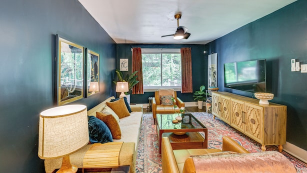 A living room with a sofa, coffee table, and television. - Easy Access to Pittsburgh: Urban Retreat w/ Deck (Pittsburgh)
