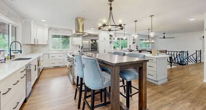 Spacious home with indoor heated pool, volley ball court, and is dog-friendly