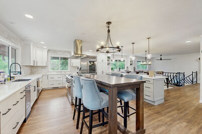 Spacious home with indoor heated pool, volley ball court, and is dog-friendly