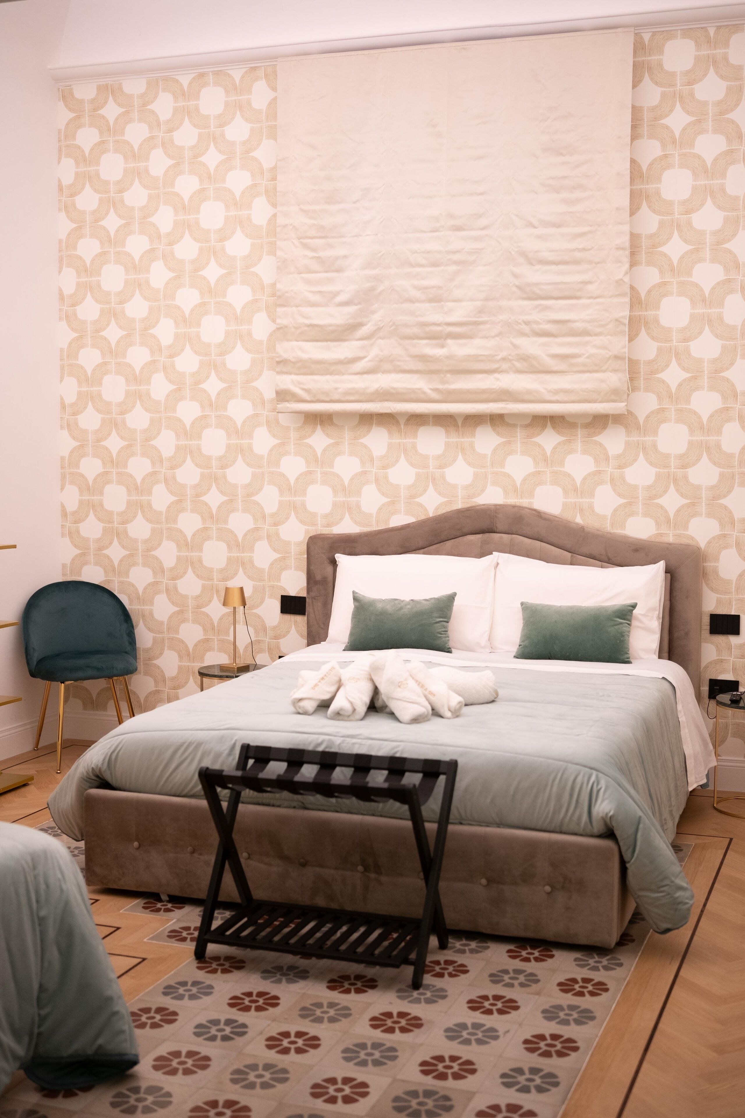 Deluxe Quadruple Room | Desk, laptop workspace, blackout drapes, iron/ironing board