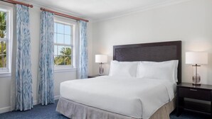 A hotel room with a large bed, two bedside tables with lamps, and a window with curtains. - Harborside 4 Atlantis Passes Included 1-23-27 - 1-30-27One Bedroom Villa 4 sleep (Paradise Island)