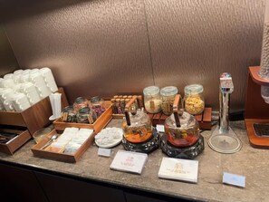 A display of tea and snacks with various containers and a tea kettle. -  Crystal Orange Shanghai Changfeng  (Shanghai)
