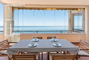 A table set for two with a view of the sea. - Apartment 'Panoramic Sea Views' with Sea View, Wi-Fi and Air Conditioning (Manilva)