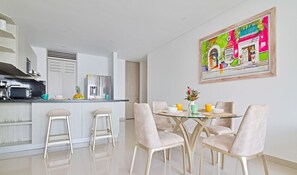 Deluxe Condo, Balcony, Bay View | Dining room - Infinitum Cartagena By HostPro (Cartagena)