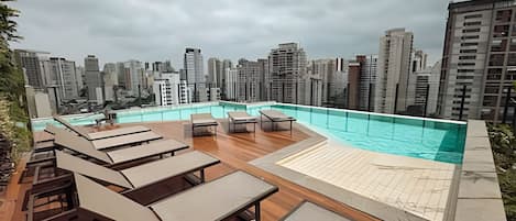 Outdoor pool, open 6:00 AM to 10:00 PM, pool umbrellas, pool loungers