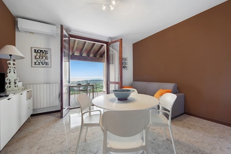 Dining. Apartment 'Vista Lago 1' with Lake View, Shared Pool, and Wi-Fi