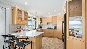 Fridge, microwave, oven, stovetop - Surfside Solace - 5 bedroom family home with stunning views of Ocean (Warilla)