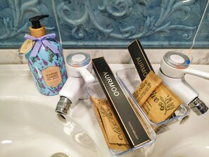 Shower, hair dryer, towels, soap