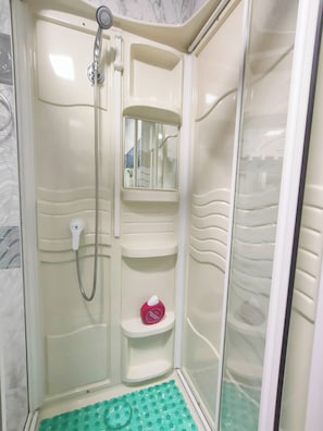 Shower, hair dryer, towels, soap