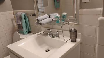 Hair dryer, towels, soap, shampoo