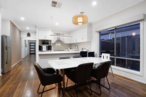 Enjoy cooking in this kitchen with a large island and ample workspace, featuring a window with a view.