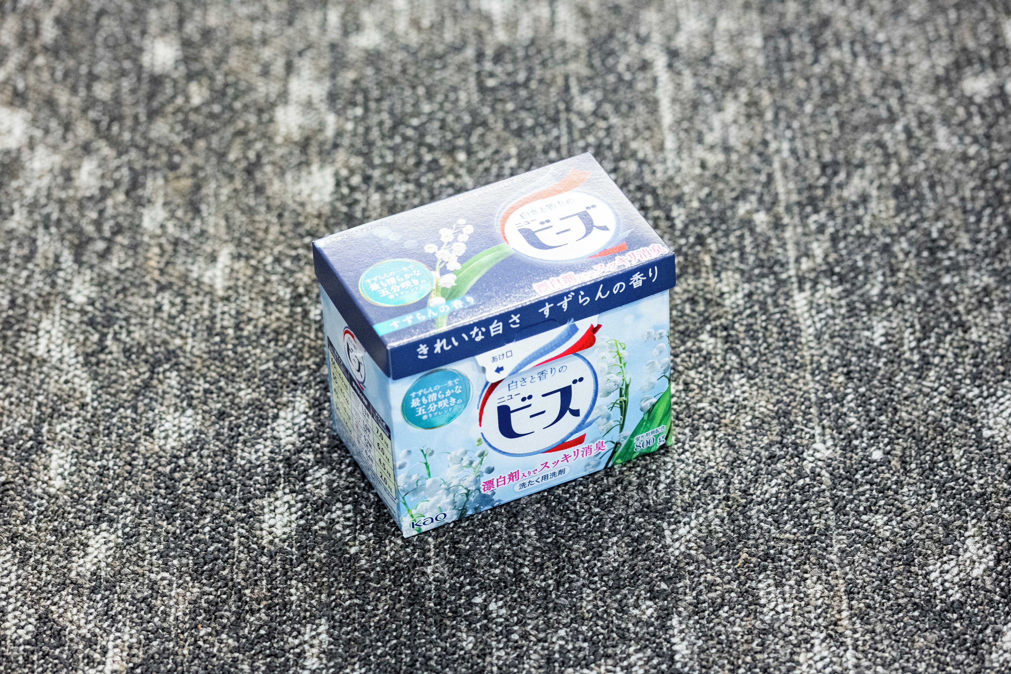 A box of a beverage on a textured surface.