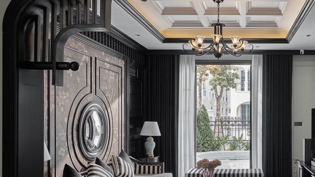 A modern living room with a sofa, armchairs, and a coffee table. A large mirror and a chandelier are visible. - Memory Villa 3-bedrooms 1' walking to the beach, Ha Long bay (Thành phố Hạ Long)