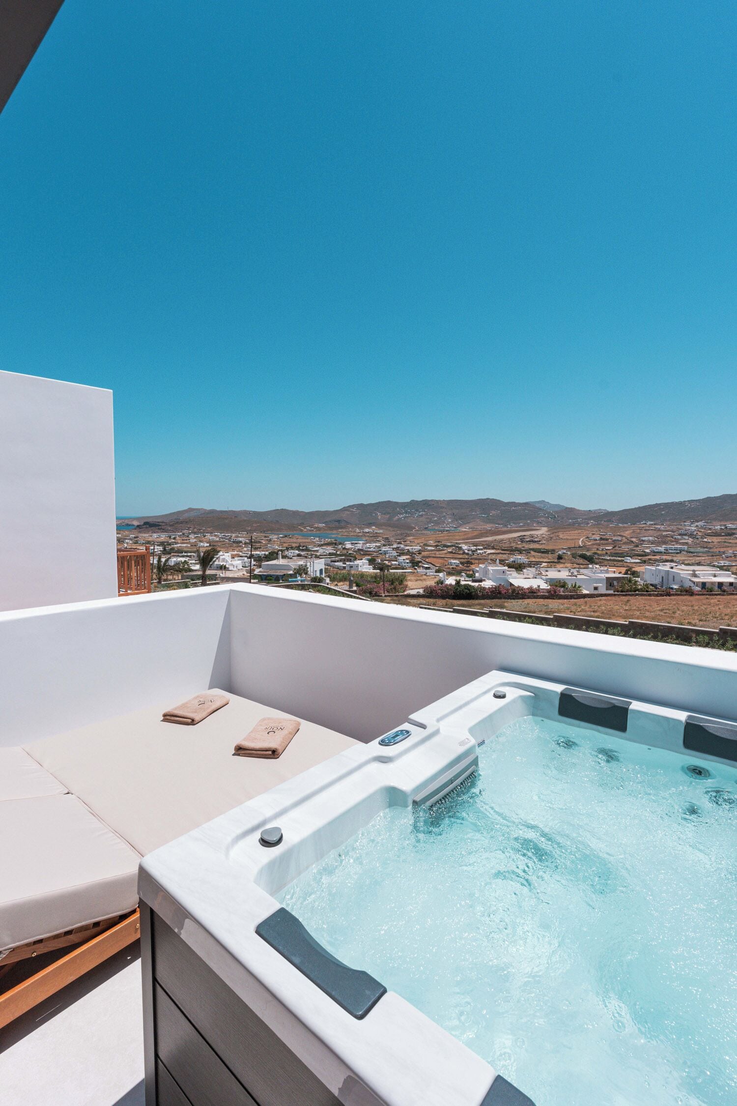 A hot tub with a clear view of the surrounding landscape.