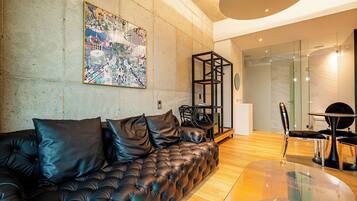 Superior Suite, Balcony, Lake View | Living area | TV