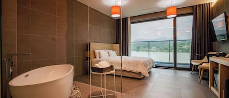 Standard Room, Balcony, Lake View | Living area | TV