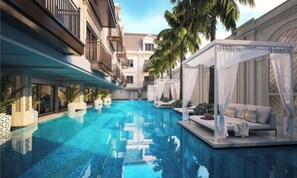 Una piscina al aire libre, cabañas de piscina gratuitas