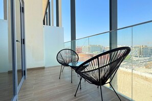 Take in panoramic views and fresh air from the comfort of your private balcony.