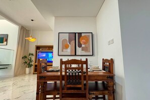 Share memorable moments over a beautifully set dining table in a refined space.