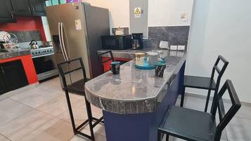 Microwave, coffee/tea maker, toaster, cookware/dishes/utensils