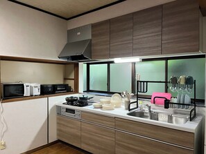 Fridge, microwave, stovetop, cookware/dishes/utensils