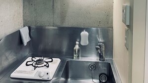 A compact kitchen with a gas stove, stainless steel sink, and a small countertop. - 15min Shinjuku/5min Hatsudai(OperaCityDirect).Quiet,perfect place/Early check-in (Shinjuku City)