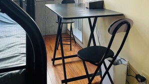 A compact room with a bunk bed, a small table with a lamp, a chair, and a phone on the wall. - 15min Shinjuku/5min Hatsudai(OperaCityDirect).Quiet,perfect place/Early check-in (Shinjuku City)