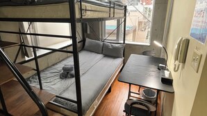 A bunk bed room with a desk and chair, a window, and a phone on the wall. - 15min Shinjuku/5min Hatsudai(OperaCityDirect).Quiet,perfect place/Early check-in (Shinjuku City)