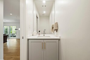 Shower, hair dryer, towels, shampoo