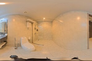 A bathroom with a toilet, sink, and shower. - Wave View Hotel (Seeb)