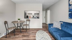 A modern apartment with a dining area, kitchen, and living room. - Modern 1BR | First Floor | Garage | Rocky River (Rocky River)