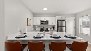 Coffee/tea maker, fridge, microwave, oven