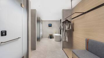 Premier Studio Suite | Living area | 65-cm LCD TV with cable channels, smart speakers, printers