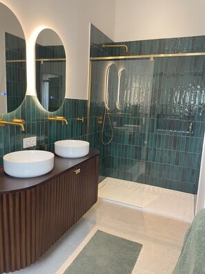 Shower, hair dryer, towels, soap