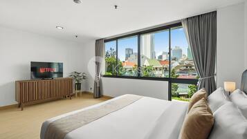 Apartemen, 2 kamar tidur, balkon, pemandangan kota | Setrika/meja setrika dan Wi-Fi gratis