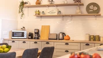 Microwave, coffee/tea maker, cookware/dishes/utensils