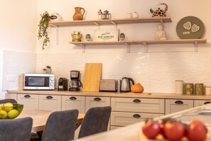 Microwave, coffee/tea maker, cookware/dishes/utensils