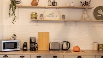 Microwave, coffee/tea maker, cookware/dishes/utensils