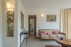 Apartment, City View | Living area | 32-inch flat-screen TV with cable channels