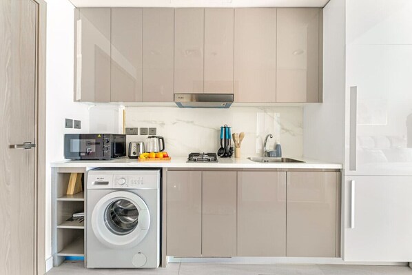 Fridge, microwave, toaster, cookware/dishes/utensils
