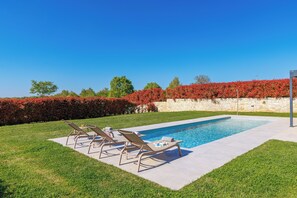 Outdoor pool, pool umbrellas, pool loungers