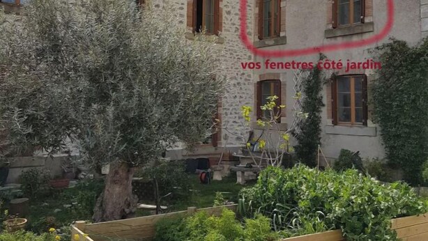A stone building with multiple windows and a garden area with various plants and a wooden raised bed. - between  carcassonne and narbonne with swimming pool (Capendu)
