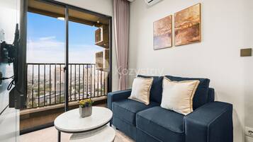 Apartment, 1 Bedroom, Balcony, City View | Living area | Flat-screen TV