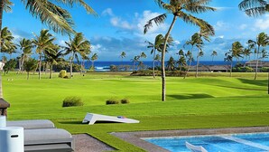 A golf course with a pool and ocean view. - Perfection in Poipu:  Brand new luxury home, ocean views, pool+spa (Koloa)