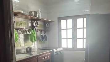 Full-sized fridge, microwave, stovetop, cookware/dishes/utensils