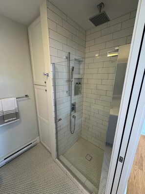 Shower, hair dryer, towels, soap