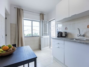 Enjoy a well-equipped kitchen with a window offering a view of the outside.