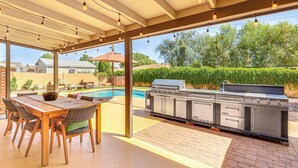 An outdoor patio with a pool, a barbecue grill, and a dining area with chairs and a table. - 3 Mi to Dtwn Shops & Eats: Mesa Home w/ Pool! (Mesa)