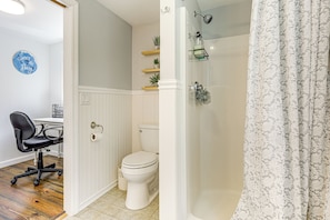 A bathroom with a toilet, shower, and a chair. - 3 Mi to Mashpee Commons: Family Home w/ Fireplace (Mashpee)