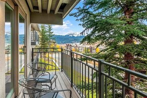 A balcony with a view of mountains and a tree. - TRUE Ski-In/Ski-Out 2BR/2BA Condo at the Base of Peach Tree Lift (Crested Butte)